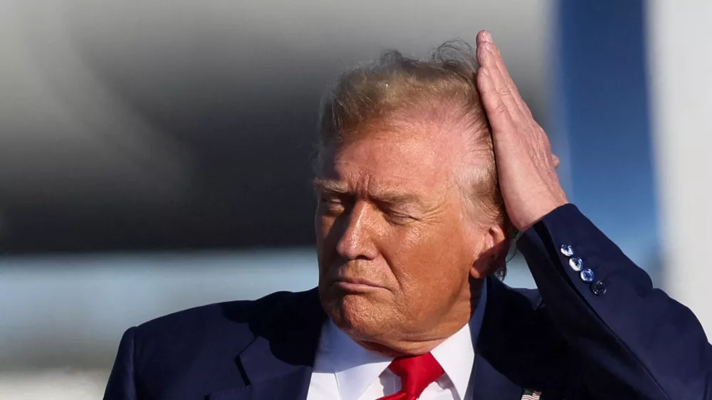 FILE PHOTO: Republican presidential candidate and former U.S. President Donald Trump combs his hair during a campaign event in Freeland, Michigan, U.S. May 1, 2024. REUTERS/Brendan McDermid/File Photo
