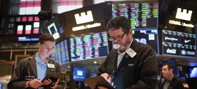 Traders work on the floor at the New York Stock Exchange in New York, Friday, July 1, 2022. Stocks are off to a weak start on Friday, continuing a dismal streak that pushed Wall Street into a bear market last month as traders worry that inflation will be tough to beat and that a recession could be on the way as well. (AP Photo/Seth Wenig)
