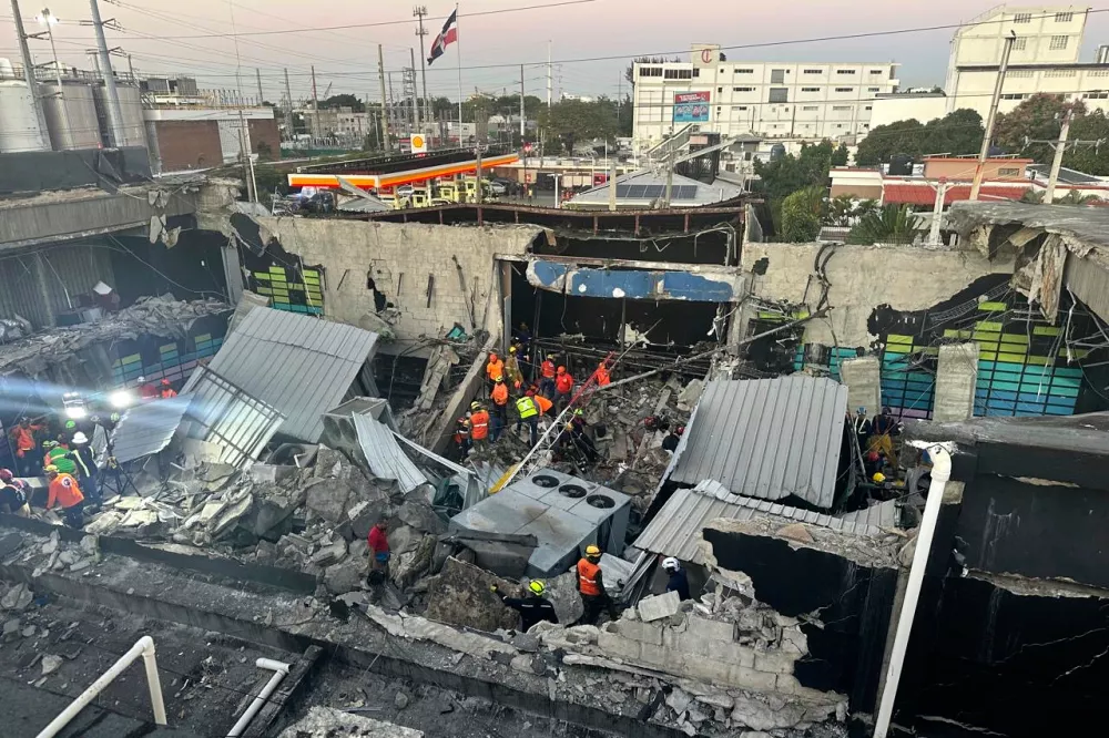 Rescue workers search for survivors at the Jet Set nightclub after its roof collapsed during a concert in Santo Domingo, Dominican Republic, early Tuesday, April 8, 2025. (Noticias SIN via AP)