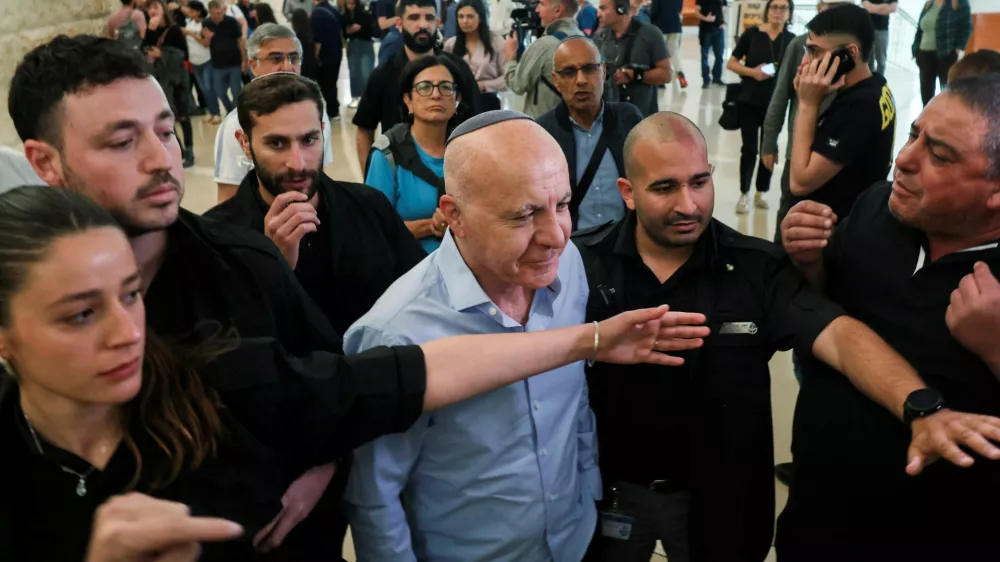 Former head of Israel's Shin Bet domestic intelligence service Yoram Cohen is guarded by the court security personnel, as he walks out from the courtroom during a hearing on the government's dismissal of the head of the Shin Bet domestic intelligence service, Ronen Bar, at the high court in Jerusalem April 8, 2025. REUTERS/Ronen Zvulun