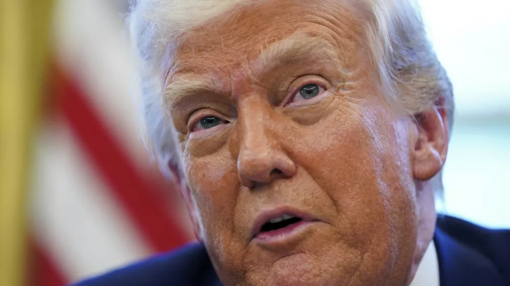 President Donald Trump speaks as he signs executive orders in the Oval Office of the White House Wednesday, April 9, 2025, in Washington. (Pool via AP)