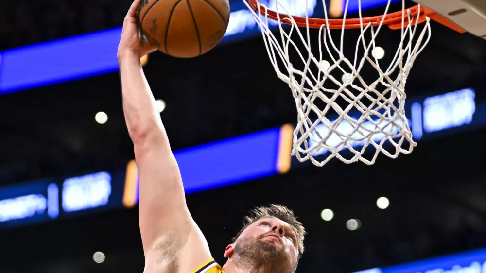 Apr 11, 2025; Los Angeles, California, USA; Los Angeles Lakers guard Luka Doncic (77) dunks against the Houston Rocketsduring the first half at Crypto.com Arena. Mandatory Credit: Jonathan Hui-Imagn Images
