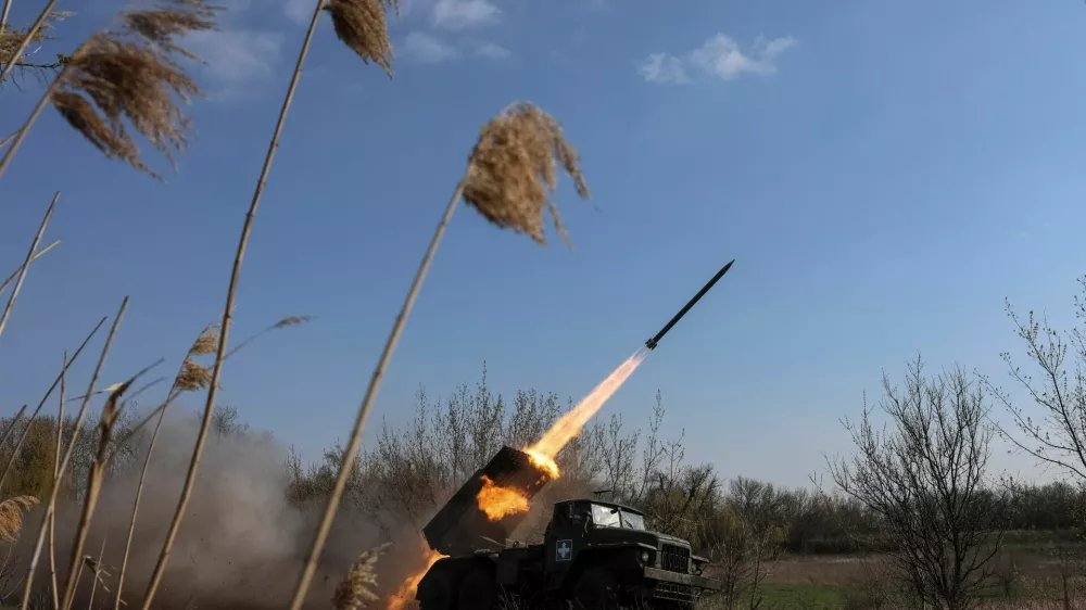 A serviceman of the 68th Oleksa Dovbush Separate Jaeger Brigade of the Armed Forces of Ukraine fires a BM-21 Grad multiple-launch rocket system toward Russian troops, on a front line, amid Russia's attack on Ukraine, near the city of Pokrovsk, Donetsk region, Ukraine April 9, 2025. REUTERS/Anatolii Stepanov