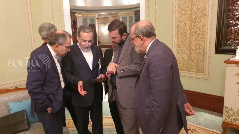 Iran's Foreign Minister Abbas Araqchi speaks with the members of the Iranian delegation after the negotiation in Muscat, Oman, April 12, 2025. KhabarOnline/WANA (West Asia News Agency)/ Handout via REUTERS ATTENTION EDITORS - THIS PICTURE WAS PROVIDED BY A THIRD PARTY. WATERMARK FROM SOURCE.