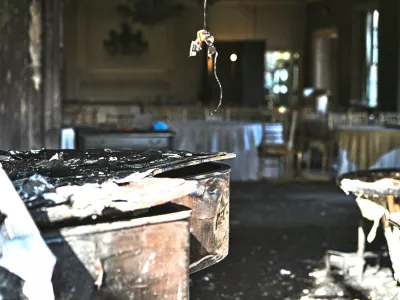 A charred piano, left, is visible inside the Pennsylvania governor's official residence after a man was arrested in the alleged arson that forced Gov. Shapiro, his family and guests to flee in the middle of the night on the Jewish holiday of Passover, Sunday, Apr. 13, 2025, in Harrisburg, Pa. (AP Photo/Marc Levy)