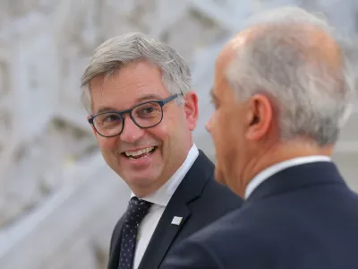 EC Commissioner for home affairs and migrations Magnus Brunner (L) talks with Italian Interior Minister Matteo Piantedosi during theMED-5 Ministers' Meeting on Interior in Naples, Italy