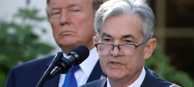 FILE PHOTO: U.S. President Donald Trump looks on as Jerome Powell, his nominee to become chairman of the U.S. Federal Reserve, speaks at the White House in Washington, U.S., November 2, 2017. REUTERS/Carlos Barria/File Photo