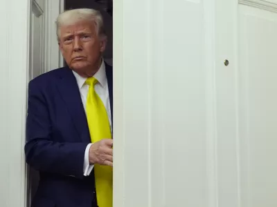 President Donald Trump arrives at a swearing in ceremony for Dr. Mehmet Oz to be Administrator of the Centers for Medicare and Medicaid Services, in the Oval Office of the White House, Friday, April 18, 2025, in Washington. (AP Photo/Alex Brandon)