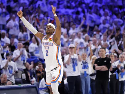 Oklahoma City Thunder guard Shai Gilgeous-Alexander reacts after making a basket during the first half in Game 1 of an NBA first-round playoff series against the Memphis Grizzlies, Sunday, April 20, 2025, in Oklahoma City. (AP Photo/Nate Billings)