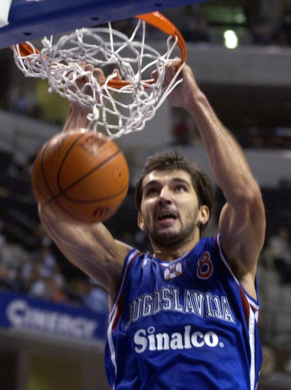 Yugoslavia's Predrag Stojakovic gets a basket on a slam dunk in the second quarter of the gold medal game agasint Argentina in the World Basketball Championships in Indianapolis, Sunday, Sept. 8, 2002. (AP Photo/Darron Cummngs)