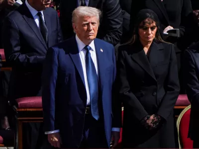 U.S President Donald Trump and first lady Melania Trump attend the funeral Mass of Pope Francis in St. Peter's Square at the Vatican, April 26, 2025. REUTERS/Nathan Howard
