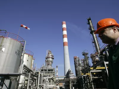 A worker is seen in the NIS Jugopetrol oil refinery, prior to a visit by Russian deputy prime minister Dmitry Medvedev, in Pancevo, some 16 kilometers (10 miles) north of Belgrade, Serbia, Monday, Feb. 25, 2008. Russia signed a gas pipeline deal with Serbia on Monday that underscores Moscow's increasingly closer ties with Belgrade. (AP Photo/Darko Vojinovic)