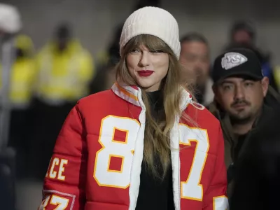 FILE - Taylor Swift wears a Kansas City Chiefs tight end Travis Kelce jacket as she arrives before an NFL wild-card playoff football game between the Chiefs and the Miami Dolphins, Saturday, Jan. 13, 2024, in Kansas City, Mo. A scourge of pornographic deepfake images generated by artificial intelligence and sexualizing people without their consent has hit its most famous victim, singer Taylor Swift, drawing attention to a problem that tech platforms and anti-abuse groups have struggled to solve. (AP Photo/Ed Zurga, File)