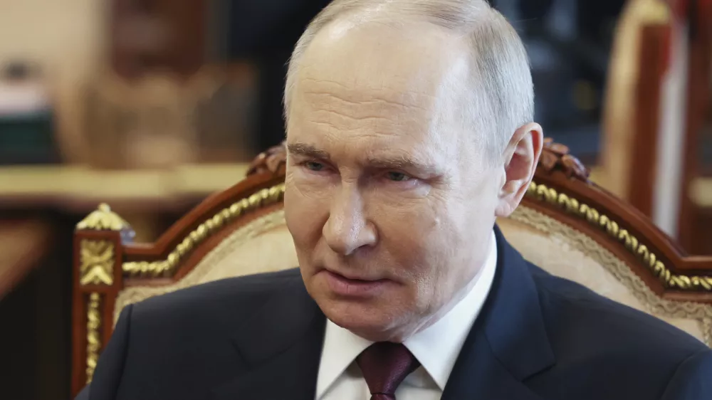 Russian President Vladimir Putin speaks with Russian Chief of General Staff Gen. Valery Gerasimov during their meeting at the Kremlin in Moscow, Russia, Saturday, April 19, 2025. (Vyacheslav Prokofyev, Sputnik, Kremlin Pool Photo via AP)