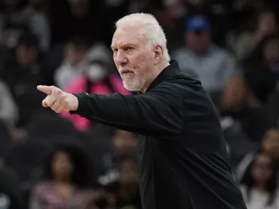 San Antonio Spurs coach Gregg Popovich signals to players during the first half of an NBA basketball game against the Utah Jazz, Friday, March 11, 2022, in San Antonio. (AP Photo/Eric Gay)