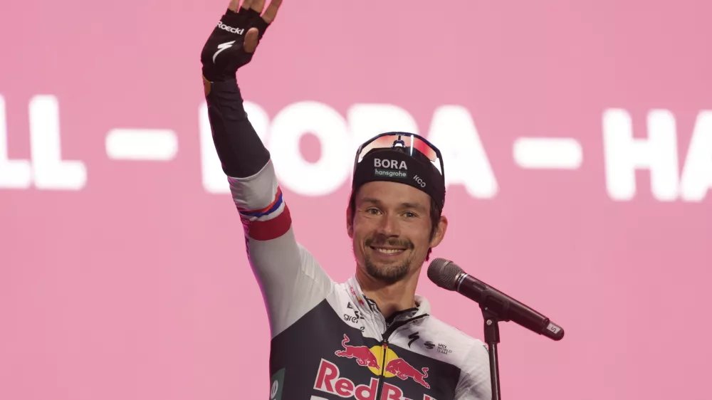 Primoz Roglic waves during team presentations, Wednesday, May 7, 2025 in Tirana, Italy, ahead of the first stage of the Giro d'Italia cycling race. (Massimo Paolone/LaPresse via AP)