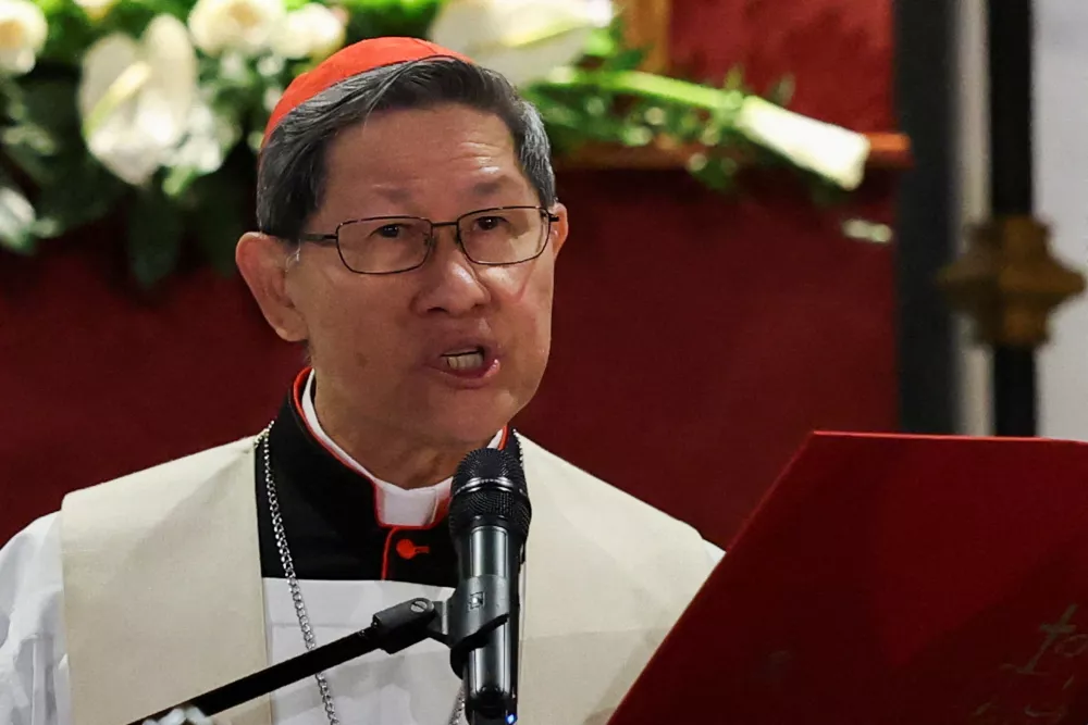 FILE PHOTO: Cardinal Luis Antonio Tagle leads the Rosary for Pope Francis outside the Papal Basilica of Saint Mary Major (Santa Maria Maggiore), following the death of the pontiff, in Rome, Italy, April 24, 2025. REUTERS/Hannah McKay/File Photo