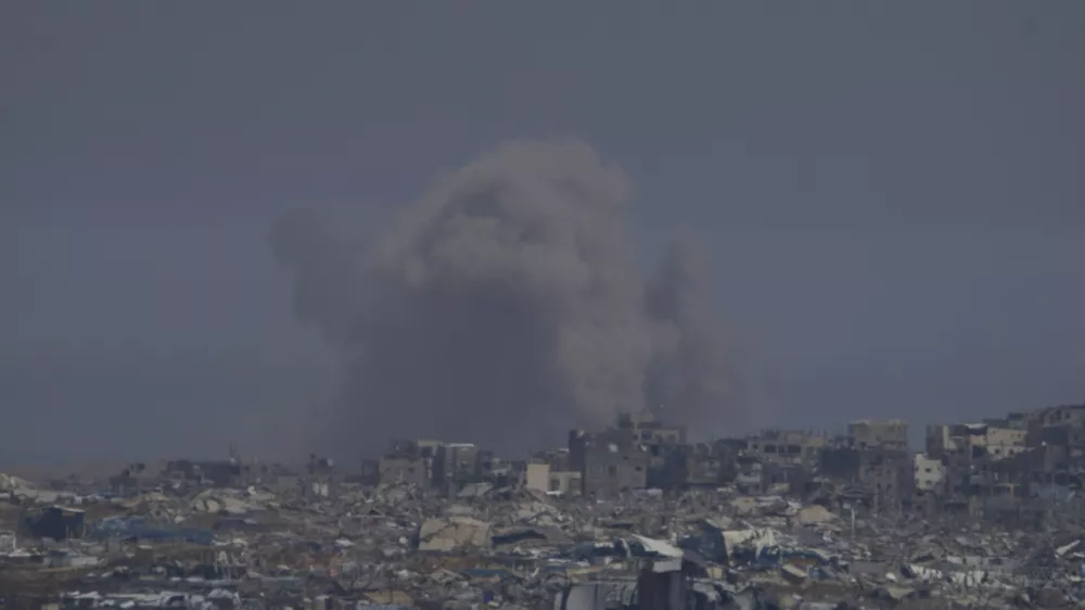 Smoke rises to the sky in the Gaza Strip as seen from southern Israel, Tuesday, May 6, 2025. (AP Photo/Ohad Zwigenberg)