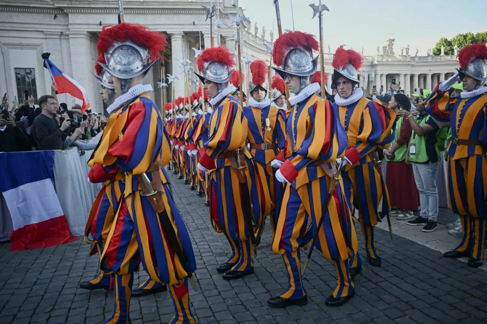 Swiss guards gather after white smoke rose from the chimney on the Sistine Chapel, indicating that a new pope has been elected, at the Vatican, May 8, 2025.REUTERS/Dylan Martinez
