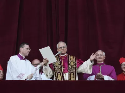 Newly elected Pope Leo XIV addresses the faithful from the balcony of St. Peter's Basilica at the Vatican, Thursday, May 8, 2025. (AP Photo/Alessandra Tarantino)