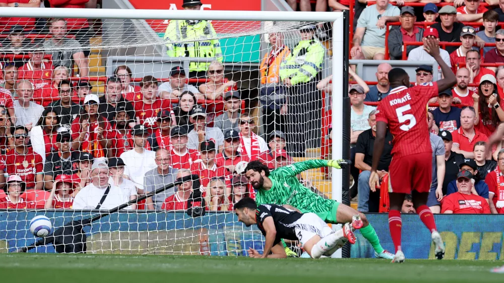Soccer Football - Premier League - Liverpool v Arsenal - Anfield, Liverpool, Britain - May 11, 2025 Arsenal's Mikel Merino scores their second goal REUTERS/Phil Noble EDITORIAL USE ONLY. NO USE WITH UNAUTHORIZED AUDIO, VIDEO, DATA, FIXTURE LISTS, CLUB/LEAGUE LOGOS OR 'LIVE' SERVICES. ONLINE IN-MATCH USE LIMITED TO 120 IMAGES, NO VIDEO EMULATION. NO USE IN BETTING, GAMES OR SINGLE CLUB/LEAGUE/PLAYER PUBLICATIONS. PLEASE CONTACT YOUR ACCOUNT REPRESENTATIVE FOR FURTHER DETAILS..