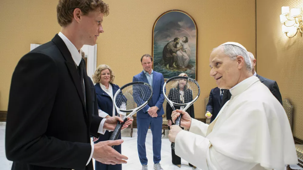 Italy's Jannik Sinner, left, shares a light moment with Pope Leo XIV on the occasion of their meeting at the Vatican, Wednesday, May 14, 2025. (Vatican Media via AP)