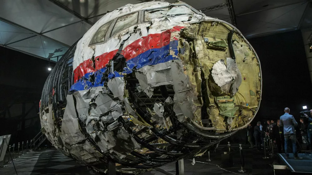 FILE PHOTO: The reconstructed wreckage of the MH17 airplane is seen after the presentation of the final report into the crash of July 2014 of Malaysia Airlines flight MH17 over Ukraine, in Gilze Rijen, the Netherlands, October 13, 2015. REUTERS/Michael Kooren/File Photo