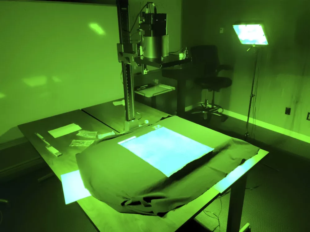 This photo provided by R.B. Toth Associates shows researchers using imaging technology on a copy of the Magna Carta from 1300 to reveal details that are not visible to the human eye on March 19, 2024, at the Weissman Preservation Center at Harvard University, in Cambridge, Mass. (R.B. Toth Associates via AP)