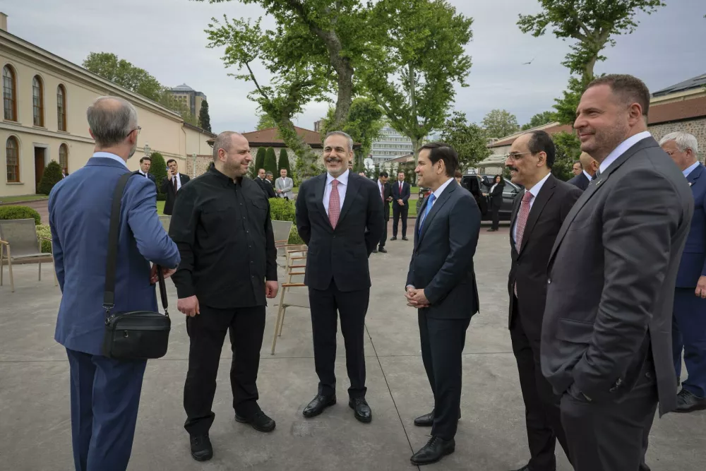 In this handout photo released by Turkish Foreign Ministry, Ukraine's Foreign Minister Andrii Sybiha, 2nd left, U.S. Secretary of State Marco Rubio, third right, Turkish Foreign Minister Hakan Fidan, center, and Ukrainian Head of Presidential Office Andriy Yermak, right, talk before their meeting at Dolmabahce palace in Istanbul, Turkey, Friday, May 16, 2025. (Turkish Foreign Ministry via AP)