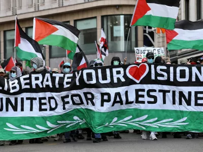 Pro-Palestinian demonstrators hold flags during a protest, on the day of the Grand Final of the 2025 Eurovision Song Contest in Basel, Switzerland, May 17, 2025. REUTERS/Christian Hartmann