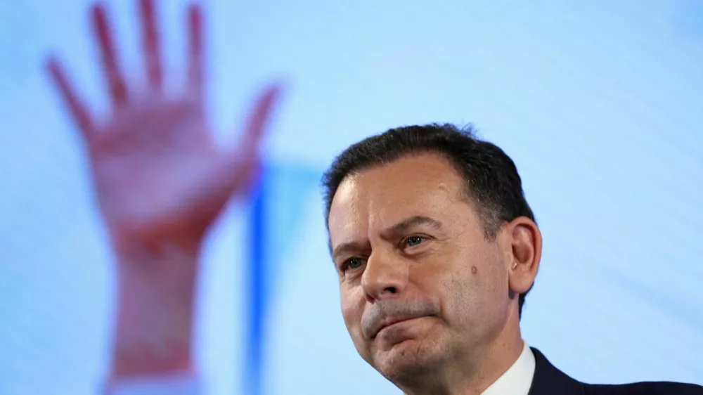 Portugal's Social Democratic Party (PSD) and Democratic Alliance (AD) leader Luis Montenegro looks on, following the exit polls, at his electoral night headquarters, in Lisbon, Portugal, May 19, 2025. REUTERS/Violeta Santos Moura REFILE - CORRECTING DATE
