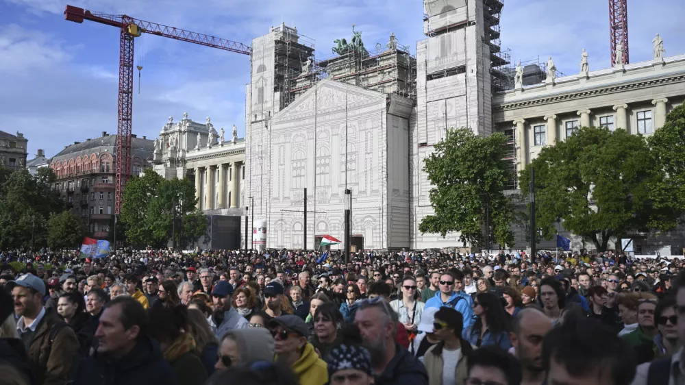 People attend a demonstration held to oppose a bill by the country's right-wing government that critics say targets free speech and independent media, in front of the Parliament building in Budapest, Hungary, Sunday, May 18, 2025. (Zoltan Balogh/MTI via AP)