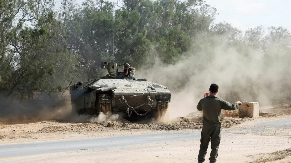 An Israeli armoured personnel carrier (APC) operates near the Israel-Gaza border, amid the ongoing conflict between Israel and Hamas, in Israel, May 19, 2025 REUTERS/Ronen Zvulun   TPX IMAGES OF THE DAY  REFILE - CORRECTING TYPE OF VEHICLE FROM "AN ISRAELI TANK" TO "AN ISRAELI ARMOURED PERSONNEL CARRIER (APC)