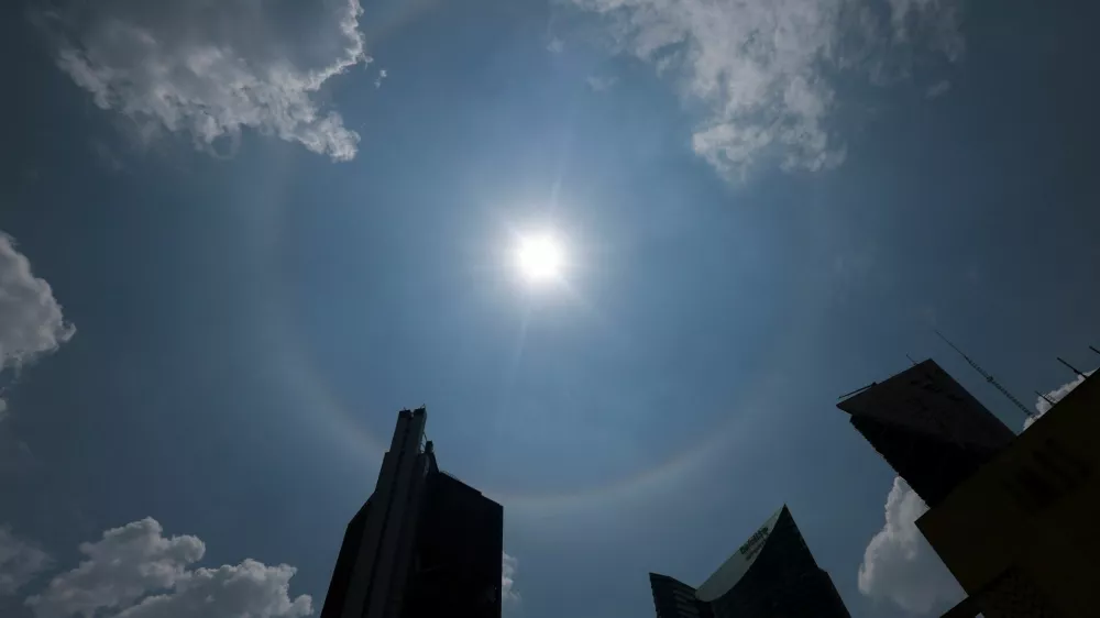 A solar halo is seen above buildings in Mexico City, Mexico May 24, 2025. REUTERS/Henry Romero