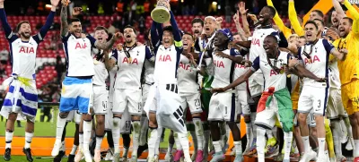 Tottenham Hotspur's Son Heung-Min lifts the trophy with teammates following the team's victory in the UEFA Europa League final against Manchester United at the Estadio de San Mames in Bilbao, Spain, Wednesday, May 21, 2025. (Nick Potts/PA via AP)