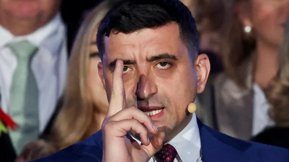 Presidential candidate George Simion reacts to exit polls of Romania's second round of the presidential election, in front of the parliament in Bucharest, Romania, May 18, 2025. REUTERS/Louisa Gouliamaki