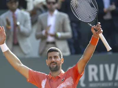 Novak Djokovic of Serbia, reacts after winning a game against to Cameron Norrie of Britain, during their semi-final tennis match, at the ATP 250 Geneva Open tournament in Geneva, Switzerland, Friday, May 23, 2025. (Martial Trezzini/Keystone via AP)