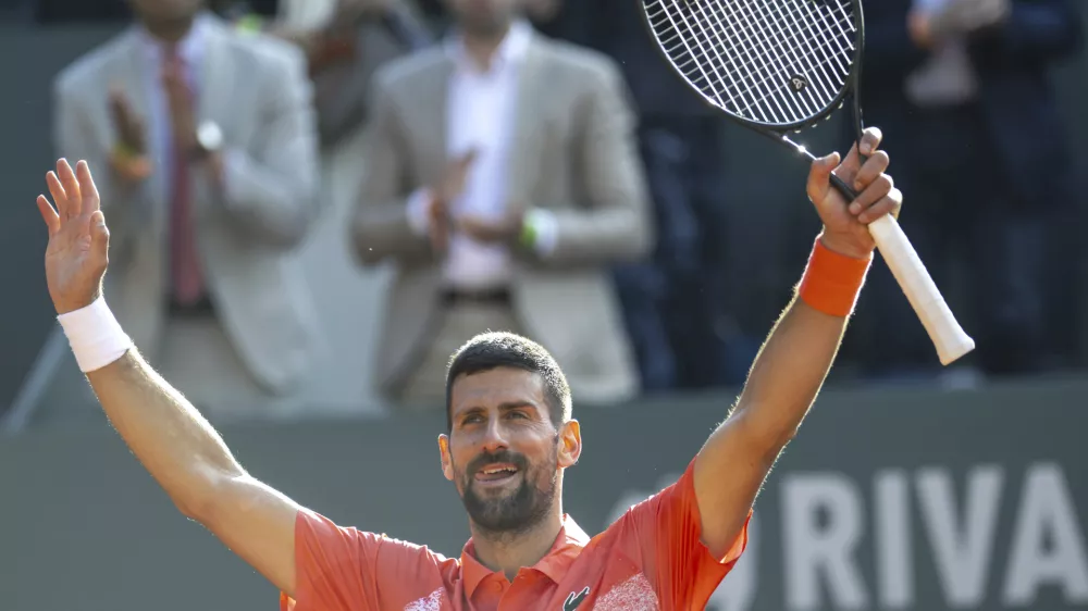 Novak Djokovic of Serbia, reacts after winning a game against to Cameron Norrie of Britain, during their semi-final tennis match, at the ATP 250 Geneva Open tournament in Geneva, Switzerland, Friday, May 23, 2025. (Martial Trezzini/Keystone via AP)