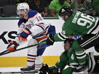May 23, 2025; Dallas, Texas, USA; Dallas Stars right wing Mikko Rantanen (96) slashes Edmonton Oilers left wing Zach Hyman (18) in the third period for game two of the Western Conference Final of the 2025 Stanley Cup Playoffs at American Airlines Center. Mandatory Credit: Jerome Miron-Imagn Images