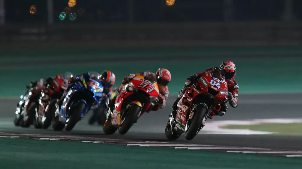 ﻿MotoGP - Qatar Grand Prix - Losail International Circuit, Lusail, Qatar - March 10, 2019  Mission Winnow Ducati's Andrea Dovizioso, Repsol Honda Team's Marc Marquez and Team SUZUKI ECSTAR's Alex Rins during the race  REUTERS/Ibraheem Al Omari