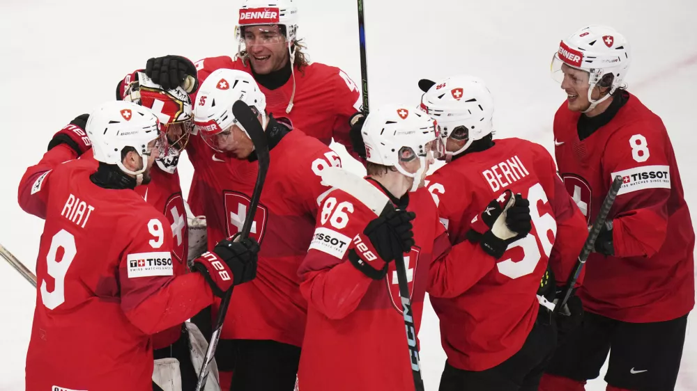 Swiss players celebrate after the semifinal match between Denmark and Switzerland at the ice hockey world championships in Stockholm,Sweden, Saturday, May 24, 2025. (AP Photo/Petr David Josek)