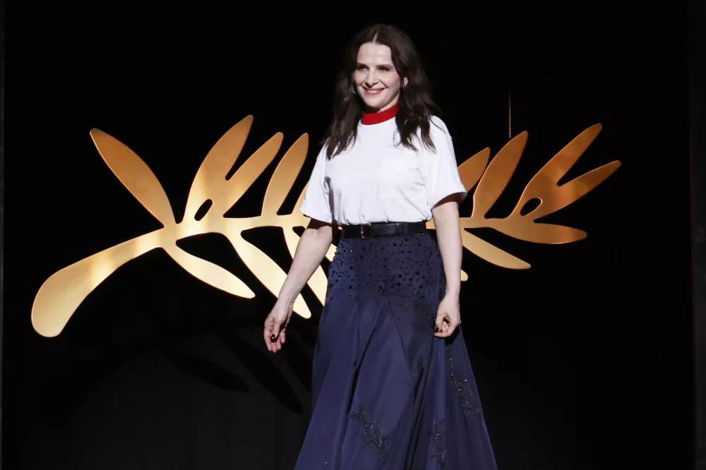 Jury president Juliette Binoche appears during the awards ceremony of the 78th international film festival, Cannes, southern France, Saturday, May 24, 2025. (Photo by Joel C Ryan/Invision/AP)