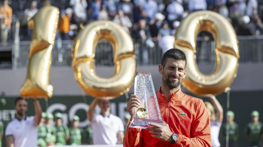 Winner Novak Djokovic of Serbia poses with the trophy after the final match of the ATP 250 Geneva Open tennis against Hubert Hurkacz of Poland, in Geneva, Switzerland, Saturday, May 24, 2025. (Martial Trezzini/Keystone via AP)