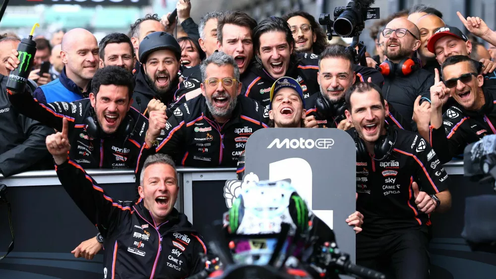 MotoGP - British Grand Prix - Silverstone Circuit, Silverstone, Britain - May 25, 2025 Aprilia Racing's Marco Bezzecchi celebrates with his team after winning the MotoGP race Action Images via Reuters/Andrew Boyers