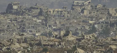 Destroyed buildings in Gaza Strip are seen from southern Israel, Monday, May 26, 2025. (AP Photo/Ariel Schalit)