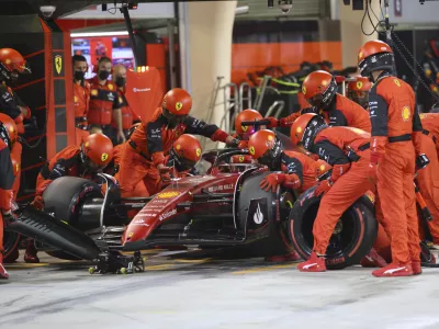 Ferrari driver Charles Leclerc of Monaco makes a pit stop during the Formula One Bahrain Grand Prix it in Sakhir, Bahrain, Sunday, March 20, 2022. (Giuseppe Cacace, Pool via AP)
