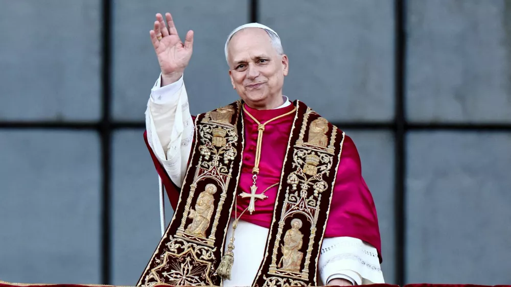 FILE PHOTO: Pope Leo XIV gestures at the balcony of Basilica di San Giovanni in Laterano (Basilica of St. John Lateran) after celebrating Mass, in Rome, Italy, May 25, 2025. REUTERS/Vincenzo Livieri/File Photo