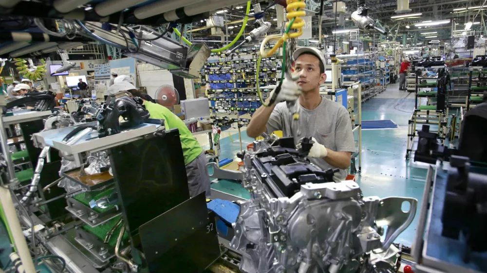 ﻿In this Aug. 2, 2017, photo, Nissan Motor Co. factory workers check engines on an assembly line at its plant in Yokohama, near Tokyo. Aiming to get an edge on its rivals in an intensely competitive industry, Japanese automaker Nissan says itâ€™s attempting to foster a corporate culture that will produce manufacturing innovations in leaps and bounds instead of steady incremental improvement. Its discussion of that effort is partly a swipe at bigger competitor Toyota Motor Corp. which for decades has favored the concept of â€śkaizenâ€ť or fine tuning and bit-by-bit progress in auto manufacturing. (AP Photo/Shizuo Kambayashi)