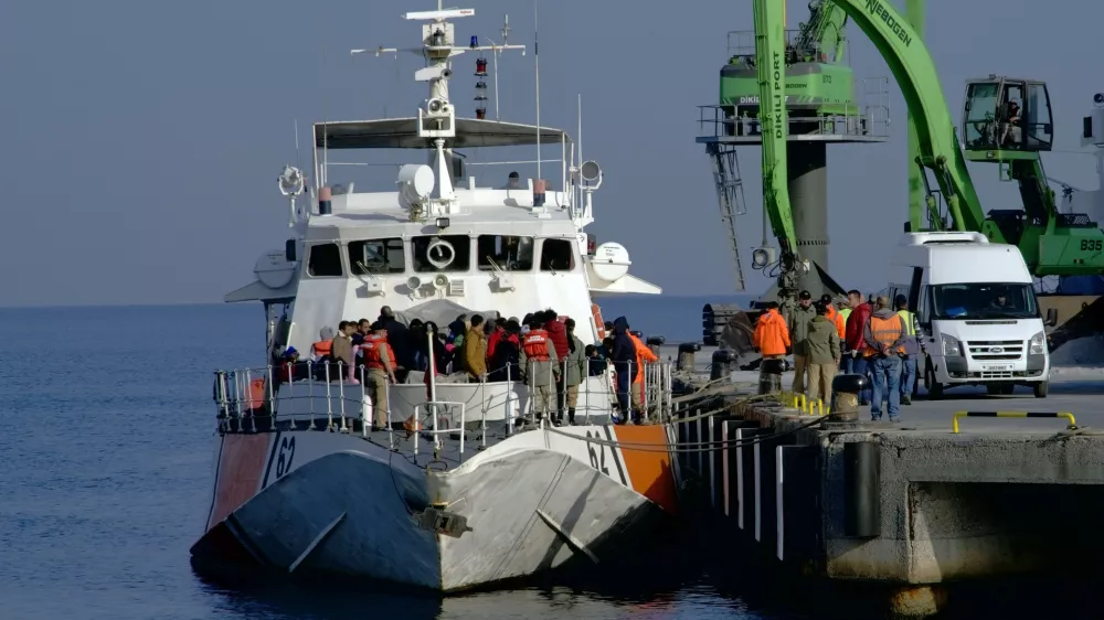 ﻿Migrants disembark after they were apprehended by the Turkish coast guard on the Aegean Sea between Turkey and Greece, in Dikili port, Turkey, Wednesday, April 6, 2016. The group of some 60 people were brought to a coast guard station in the western province of Izmir. The European Union began sending back migrants this week under a deal with Turkey aimed at preventing the flow of migrant to Europe.(AP Photo/Mehmet Guzel)