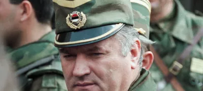 ﻿Bosnian Serb General Ratko Mladic leaves a meeting at the airport in Sarajevo, Bosnia and Herzegovina April 13, 1993. Picture taken April 13, 1993. REUTERS/Chris Helgren
